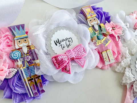 Nutcracker Baby Shower Badge Set – Mommy & Daddy to Be Floral Pins with Holiday Ribbons & Figurines